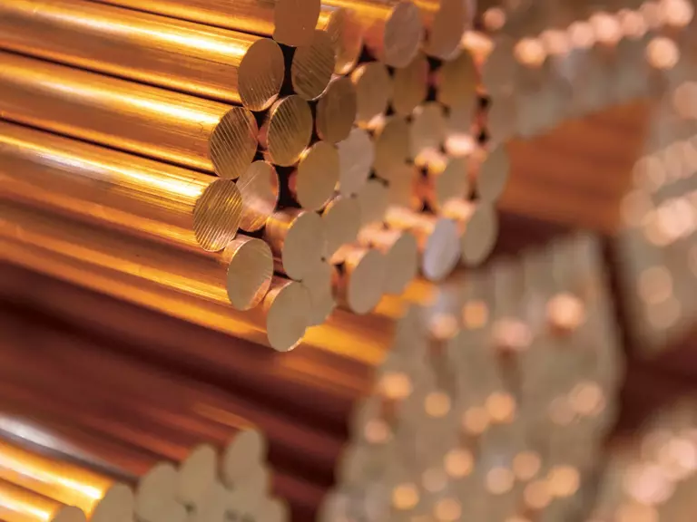Close-up of stacked copper rods