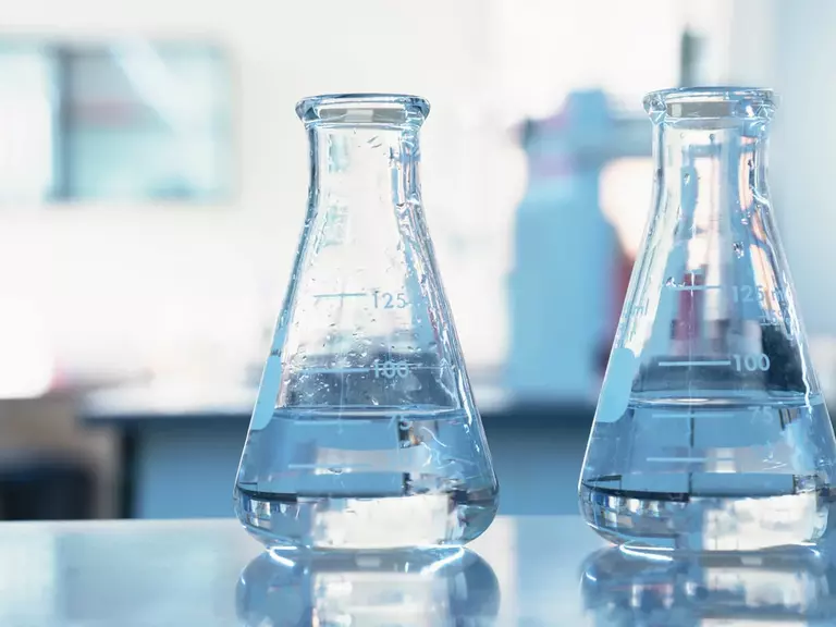 Sulphuric acid in two Erlenmeyer flasks